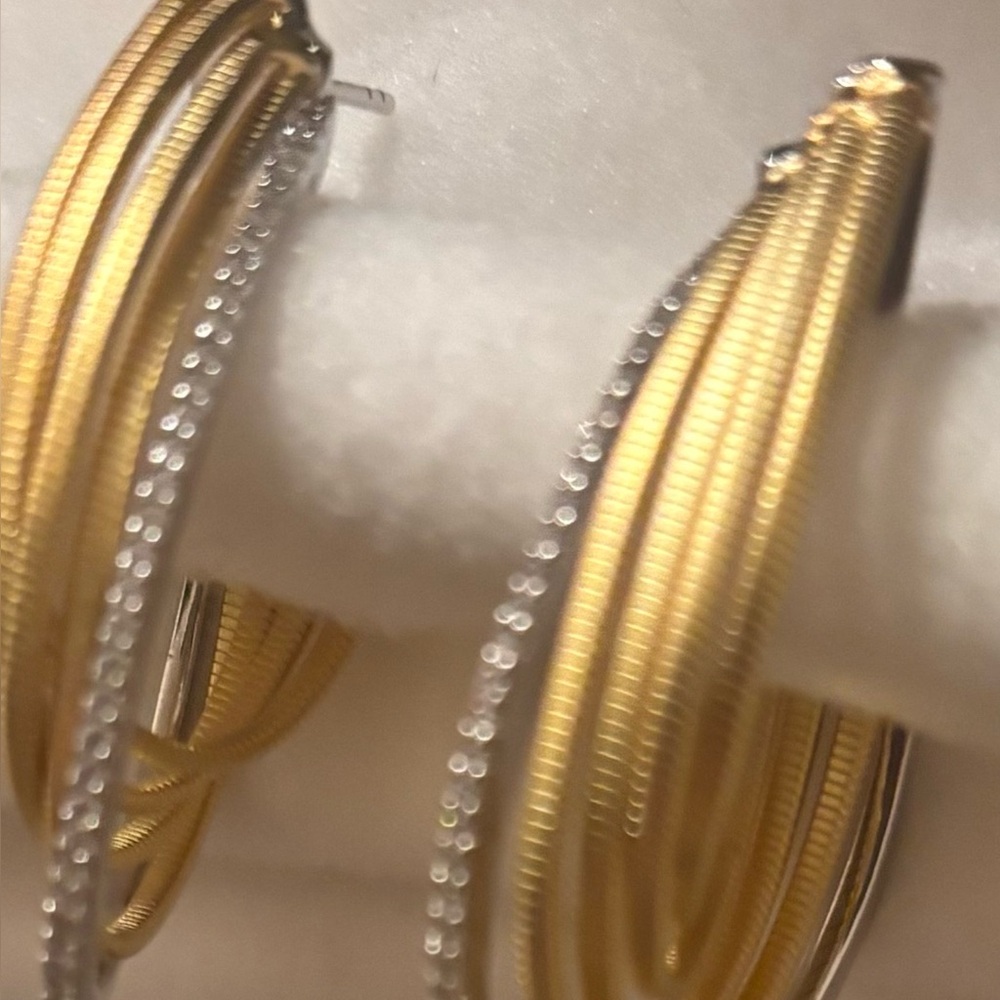 Elegant hoop sterling silver and gold plated CZ pierced earrings.